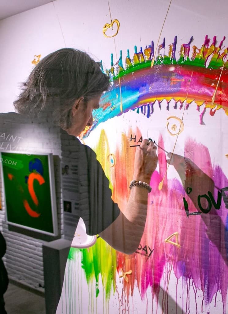 Miroslavo painting the Happy Love Day mural at NoHo House, Barcelona